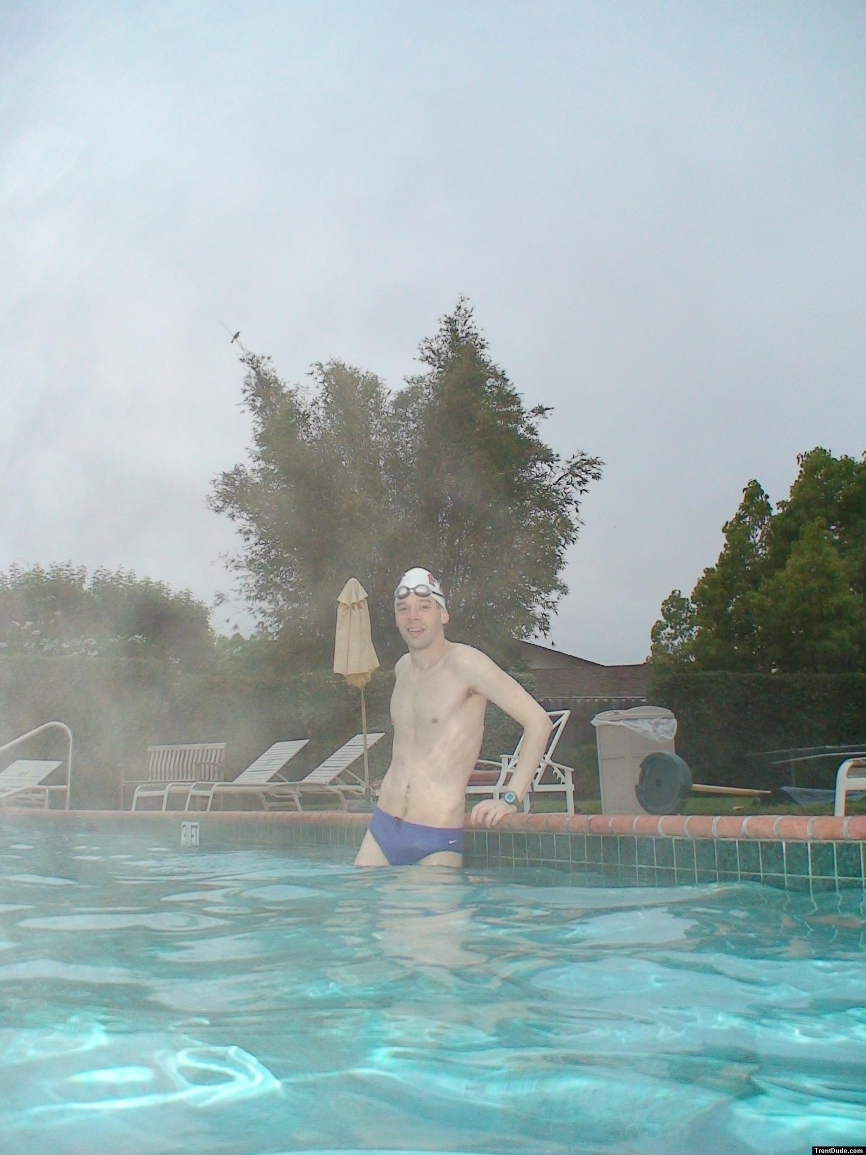 Blue Nike speedo, white swim cap