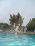 Blue Nike speedo, white swim cap