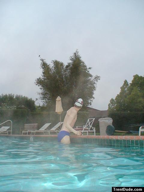 Blue Nike speedo, white swim cap