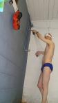 Blue Nike speedo, white swim cap