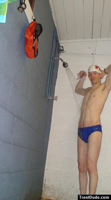 Blue Nike speedo, white swim cap (arm pits)