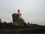 Hiker sitting on rock in white hanes underwear