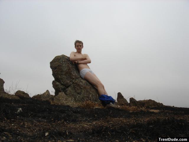 Hiker sitting on rock in white hanes underwear