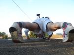 Trent doing pushups wearing Asics running shoes