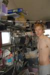 portrait - shirtless in messy house
