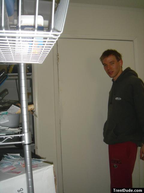 Red 49ers sweatpants, green Quiksilver sweatshirt with hood.  Smiling