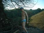 Tommy Hilfiger action brief underwear near a stick pile
