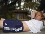 doing situps on the cement in a park