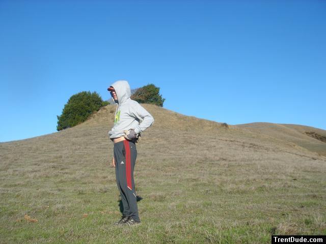 wearing Addidas Nylon sweat pants and sweatshirt in a field