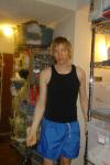 showing muscles in a muscle shirt