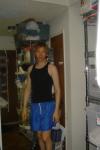 trying to look like a guy in a muscle shirt