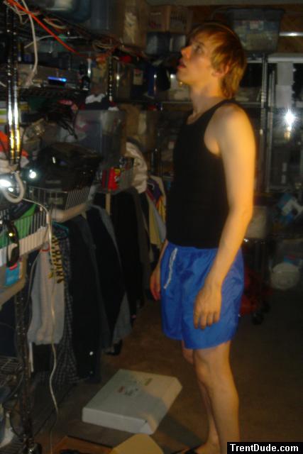 Looking up in a black tanktopr (for sale) and blue lycra shorts