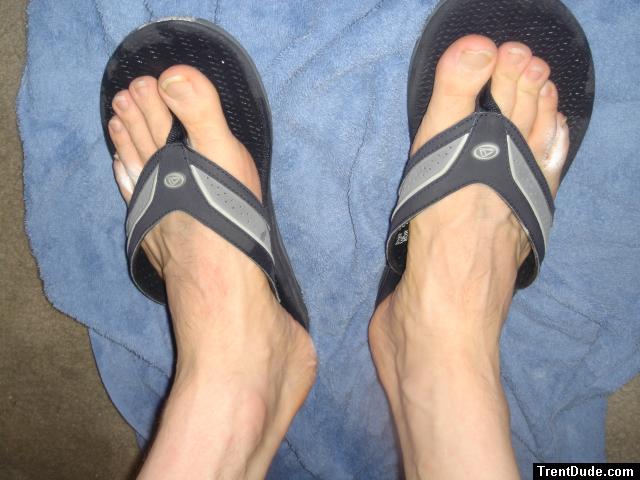 feet in Quiksilver slippers, showing veins