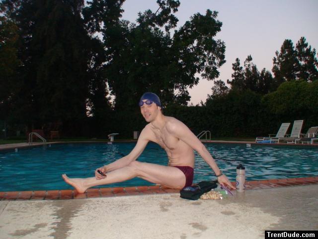 Red Speedo Aquablade swim brief, poolside stretching