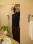 Standing up, , alone in a hotel bathroom