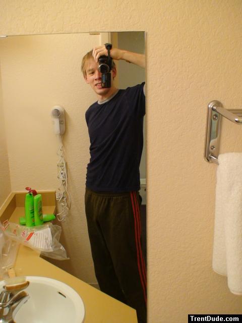 Standing up, , alone in a hotel bathroom