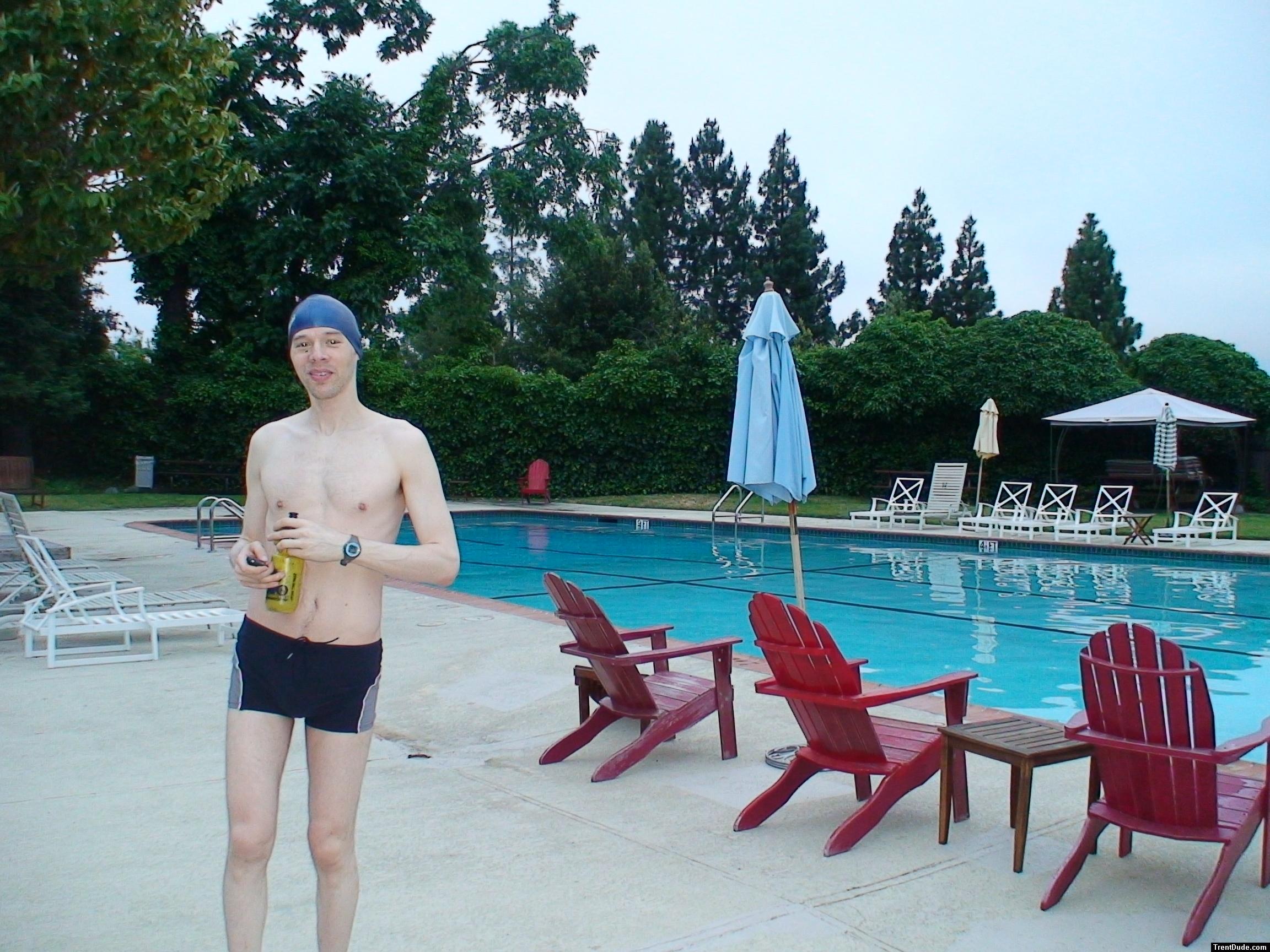 Calvin Klein swim boxers at the pool, swim cap, smile