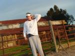 Stretching on a morning on the farm with Cypress tree in backgroung