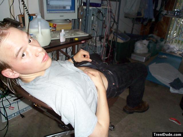 Sitting in black Levis jeans and long hair