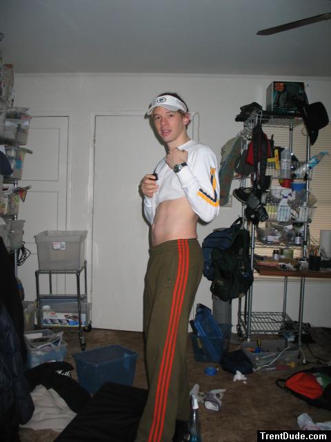 Showing off abs in Green addidas sweat pants, Green bay visor