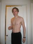 Shirtless in black pants, medium length hair