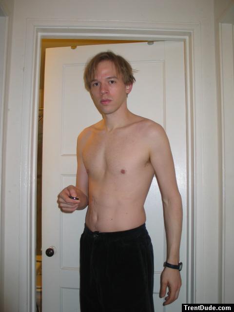 Shirtless in black pants, medium length hair