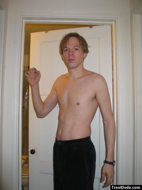 Shirtless in black pants, medium length hair