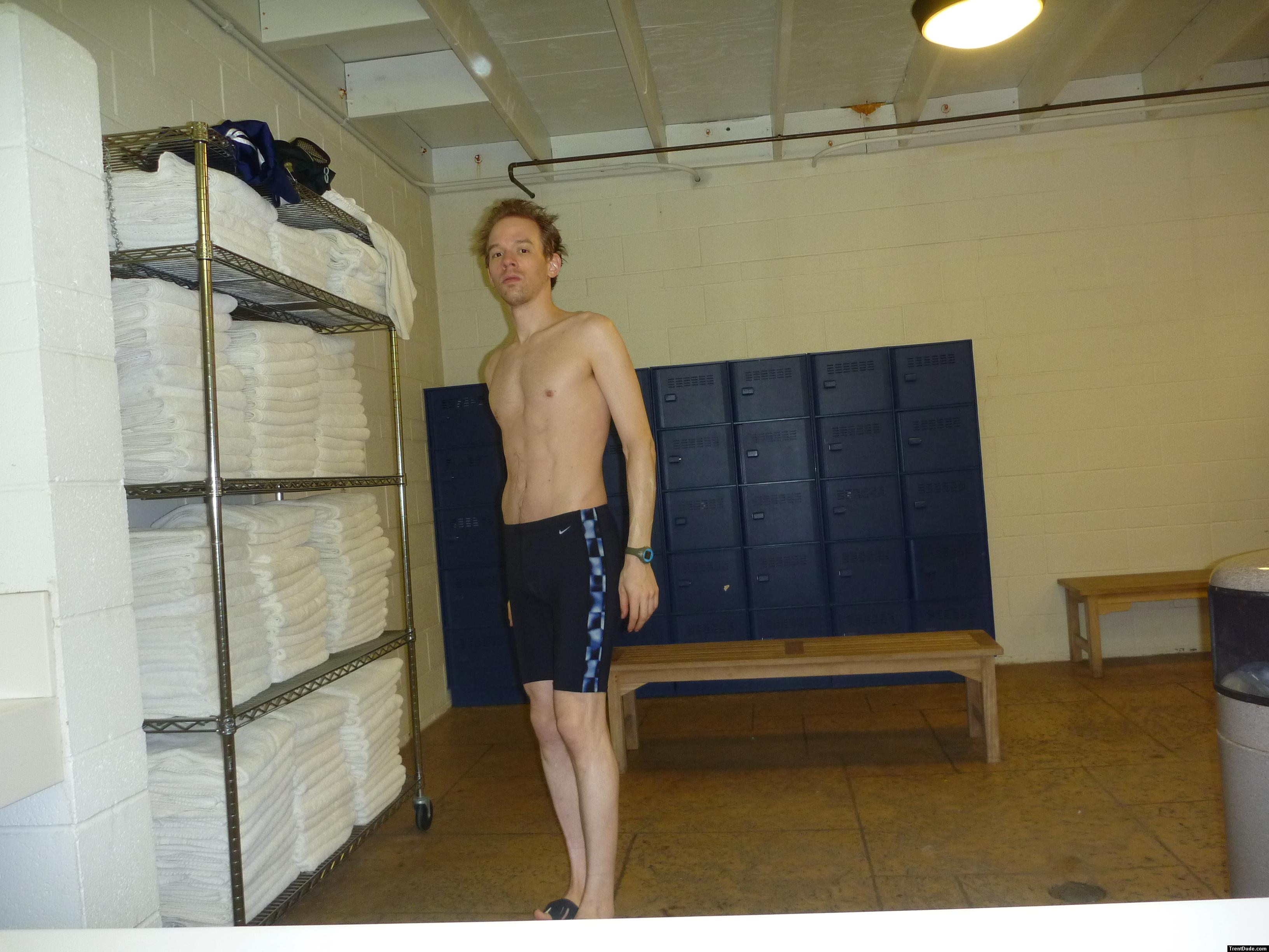 Nike swim jammer in a locker room with many towels (best)