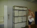 Nike swim jammer in the swim locker room, near some towels,