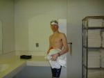 Nike swim jammer in the swim locker room, near some towels,