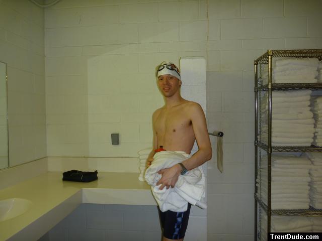 Nike swim jammer in the swim locker room, near some towels,