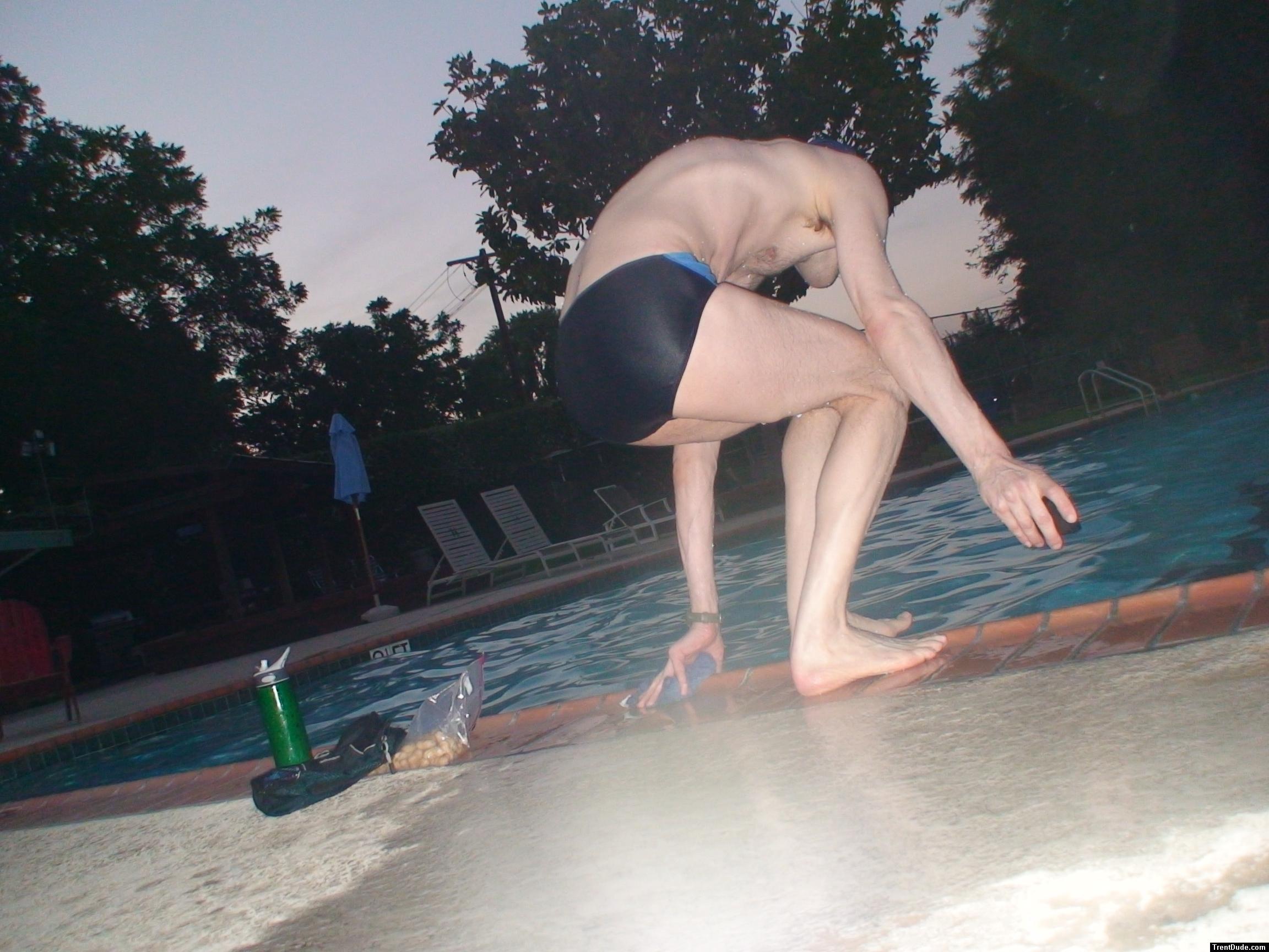 Getting ready to jump in wearing a Nike swim brief (rear)