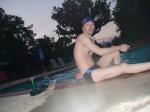 Sitting down next to the pool after a swim