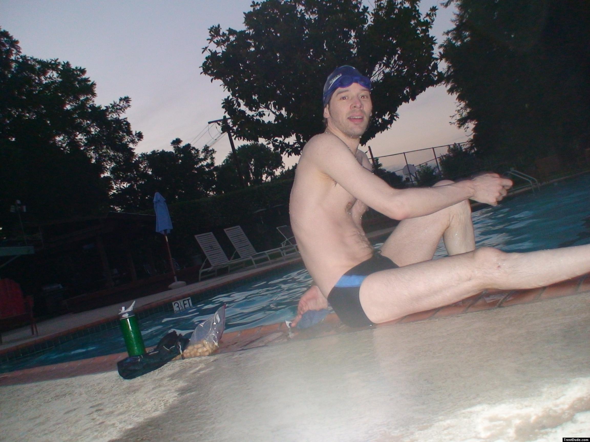 Sitting down next to the pool after a swim