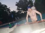 Climbing out of the pool after a swim (abs, chest hair)