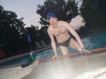Climbing out of the pool after a swim (abs, chest hair)