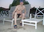 Sitting down a speedo at the pool after a long swim