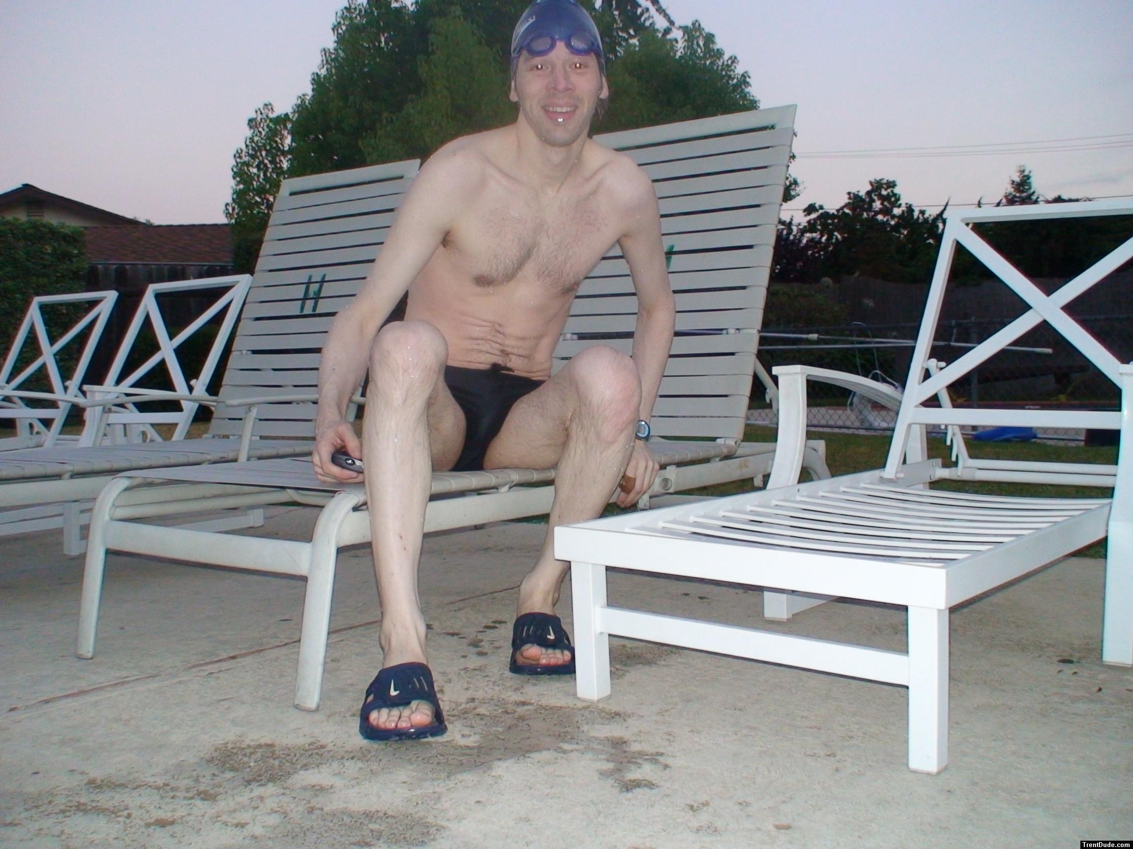 Sitting down a speedo at the pool after a long swim