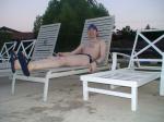 Relaxing in a speedo at the pool after a long swim