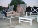 Relaxing in a deck chair at the pool after a long swim