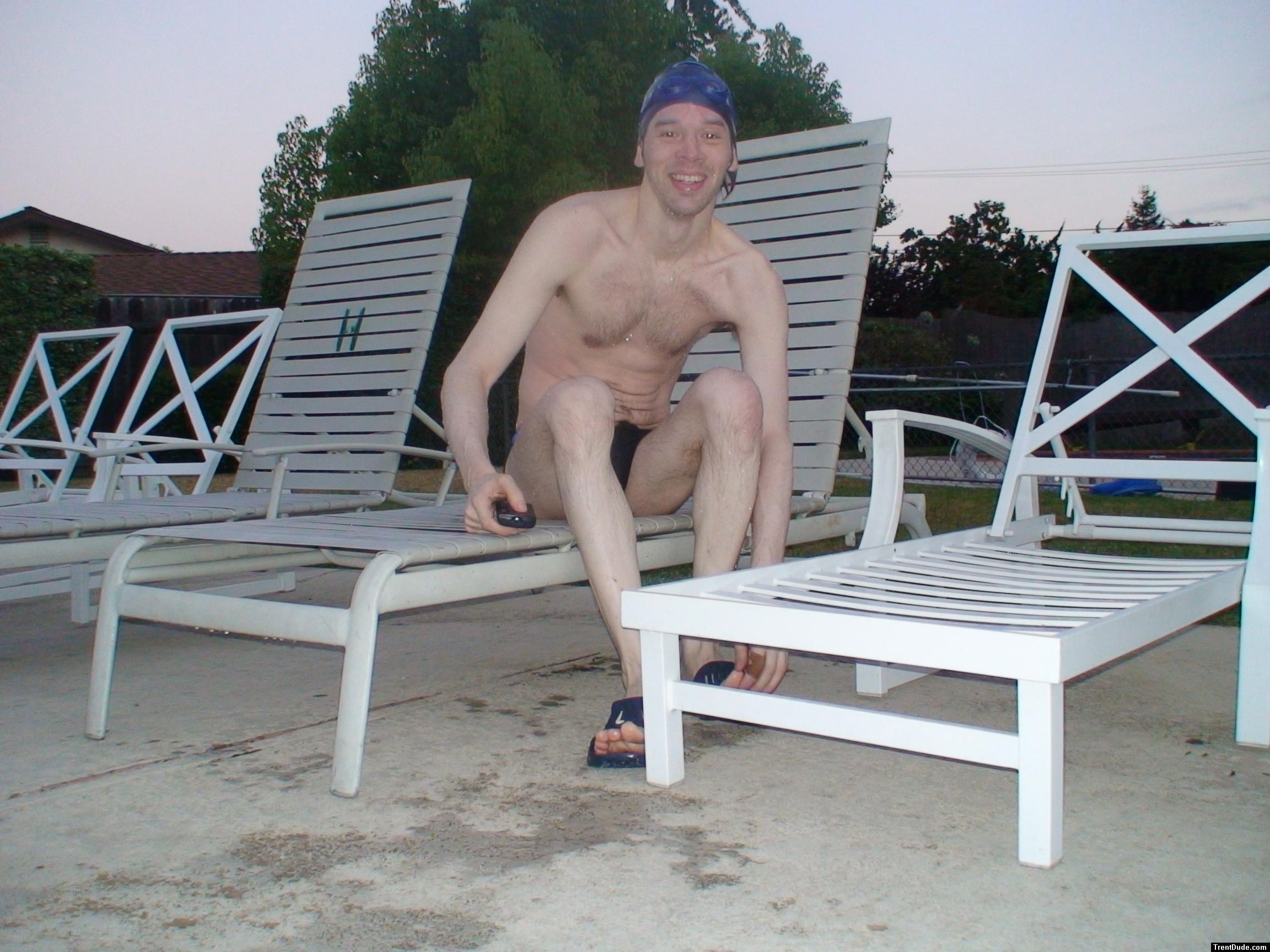 Chest hair, sitting in a deck chair at the pool