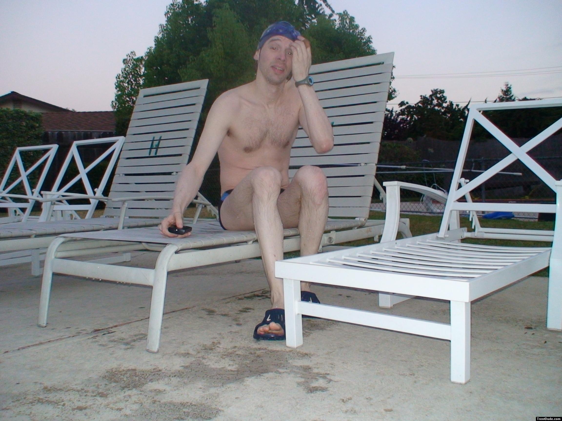Chest hair, sitting in a deck chair at the pool