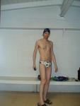 Changing in the swim locker room in a White polka dot /cow print speedo