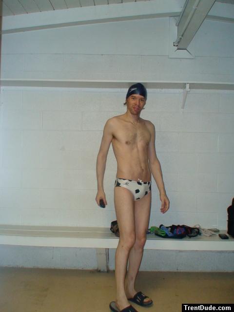 Changing in the swim locker room in a White polka dot /cow print speedo