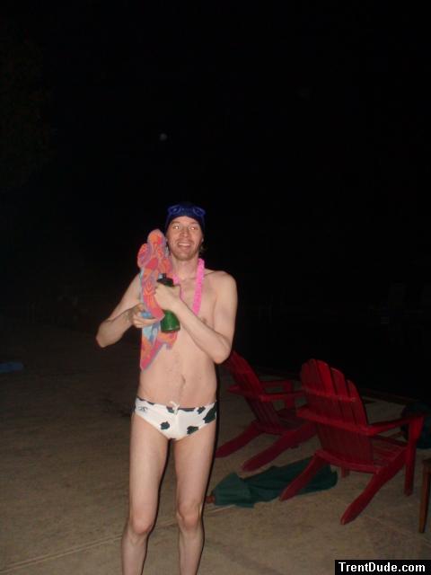 Pink lei and white cow print speedo