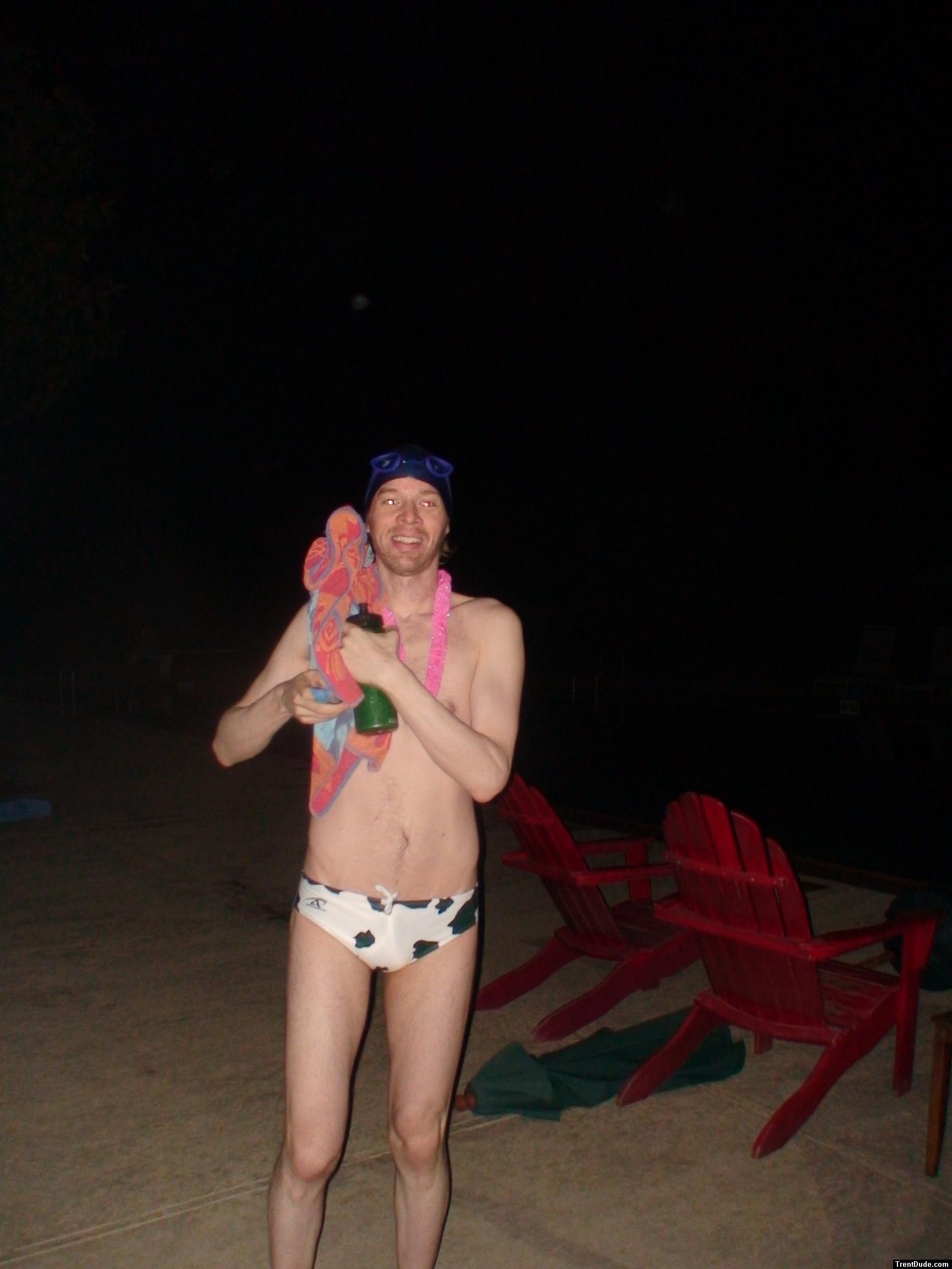 Pink lei and white cow print speedo