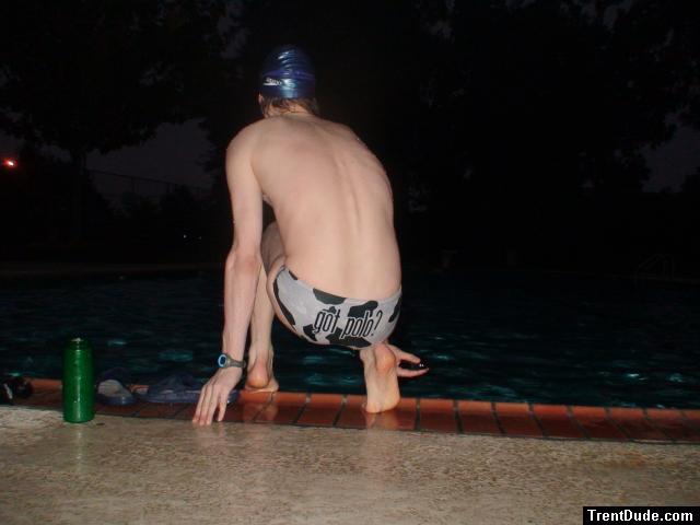 about to jump in wearing a white polka dot cow speedo (rear) (feet) ("got polo?" written on back)