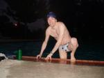 climbing out in a white polka dot/cow print  water polo swim brief, from Argonswim.com