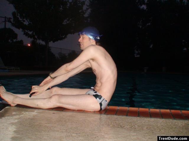 Stretching pool-side in a cow spot speedo