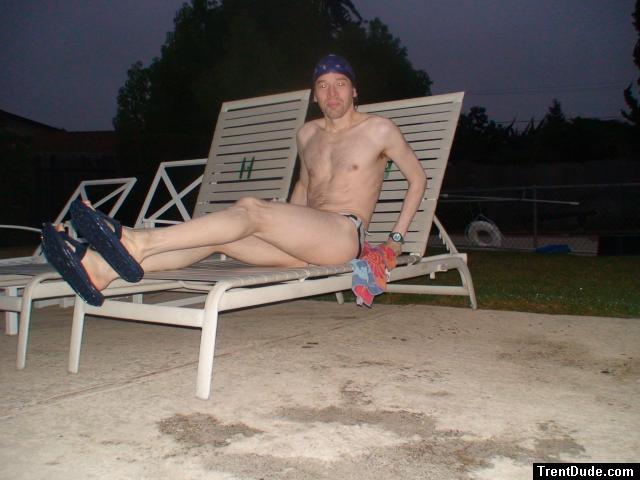 Sitting in a lounge chair in a polka dot speedo